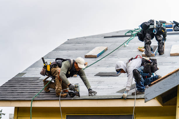 Professional Roofing technician working in North Oxford, MA